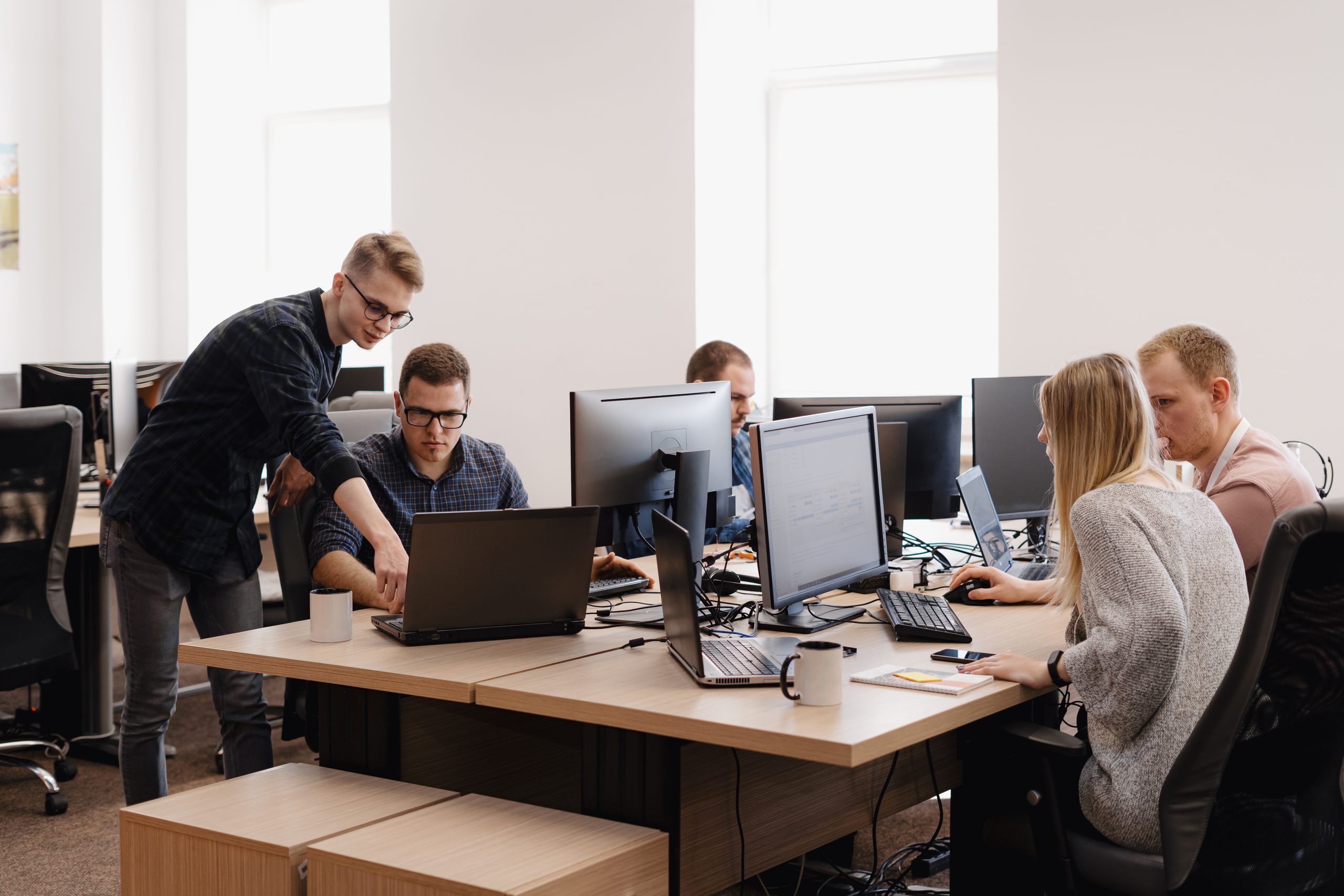 a group of people working on computers